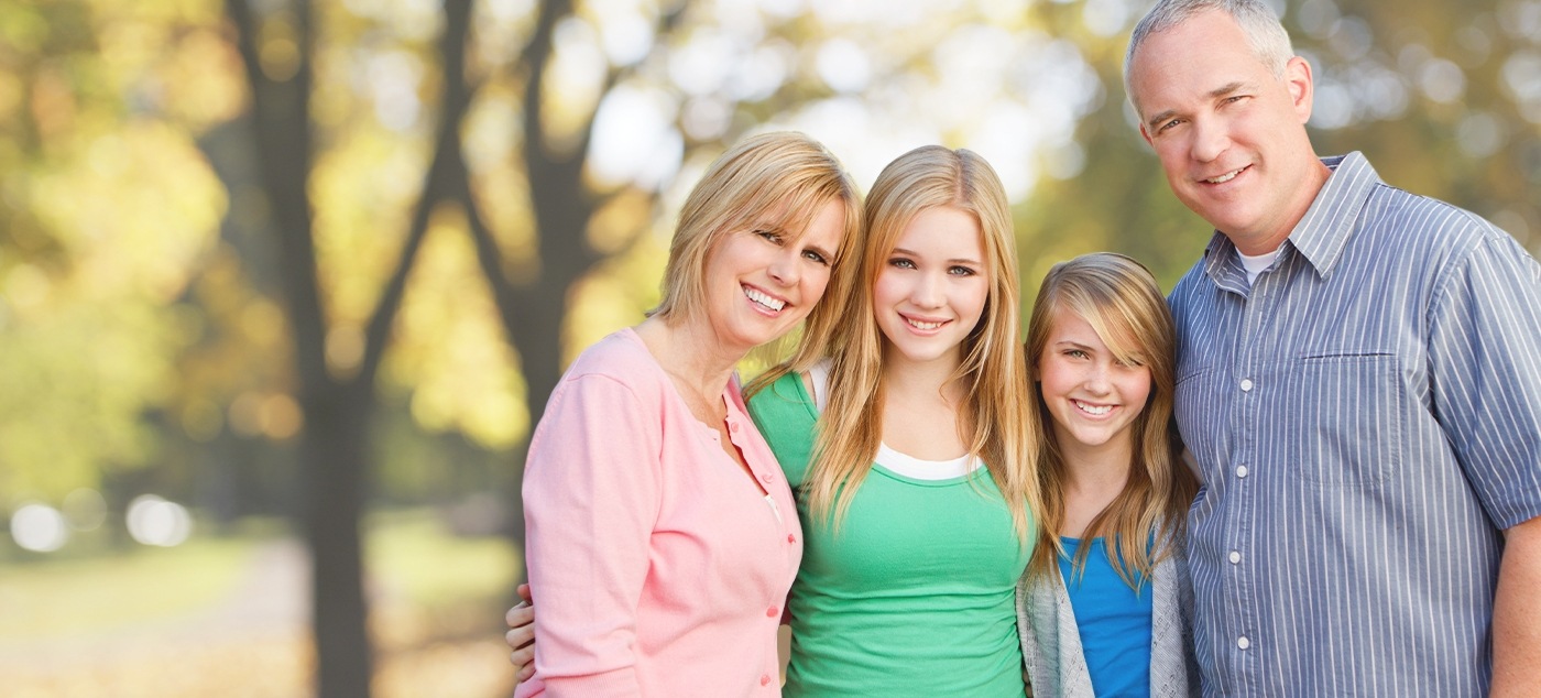 Family of four outdoors