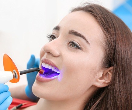 Woman receiving dental treatment