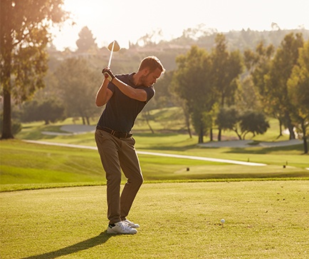 Man playing golf