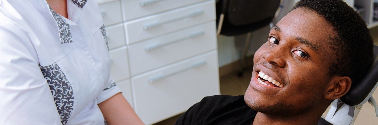 Smiling man in dental chair