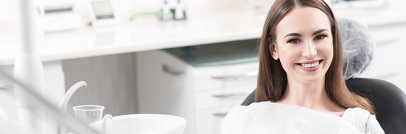 Smiling woman in dental chair