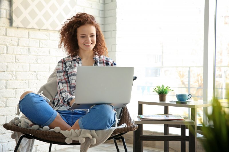 Woman reading her benefits on computer