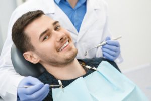 man happy receiving dental checkup