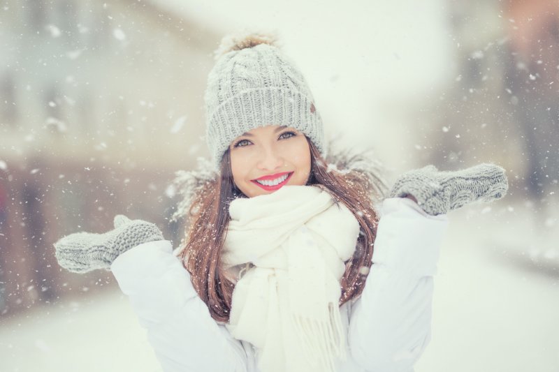 woman smiling in the snow