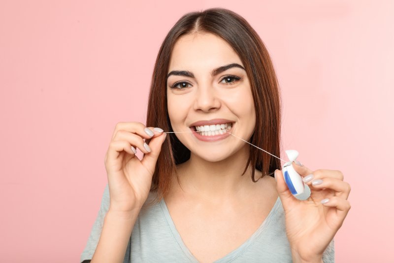 Portrait of someone flossing