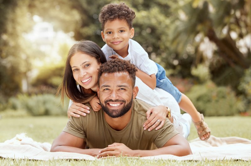 a family smiling after practicing great oral hygiene